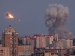 Ukrainian servicemen shoot down a Russian missile as smoke rises from the city during a Russian missile strike, amid Russia's attack on Ukraine, in Kyiv, Ukraine September 7, 2025. REUTERS/Gleb Garanich