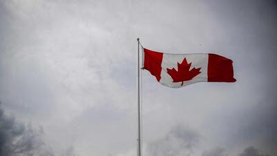 A Canadian flag flies during the Canada Day Celebrations in the Old Port in Montreal, Quebec, on July 1. (AFP)