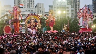 Devotees in large numbers carry idols of Lord Ganesha for immersion (Ganesh Visarjan) during the Ganesh Chaturthi festivities, in Mumbai on Sunday. (ANI Photo) (Deepak Salvi) Devotees in large numbers carry idols of Lord Ganesha for immersion (Ganesh Visarjan) during the Ganesh Chaturthi festivities, in Mumbai on Sunday. (ANI Photo) (Deepak Salvi)
