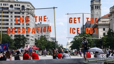 Demonstrators gathered with posters and signs saying ‘end occupation’ and ‘get the ICE out’ during a protest to end the deployment of National Guard troops patrolling the capital city's streets. (Bloomberg)