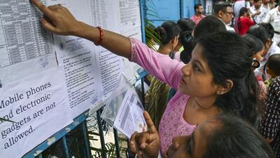 Aspirants check seating arrangement before they appear for the West Bengal School Service Commission (WBSSC) State Level Selection Test (SLST) examination, at a centre, in Kolkata, on Sunday. (PTI) Aspirants check seating arrangement before they appear for the West Bengal School Service Commission (WBSSC) State Level Selection Test (SLST) examination, at a centre, in Kolkata, on Sunday. (PTI)