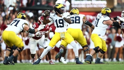 Michigan Wolverines quarterback Bryce Underwood (19) looks to pass downfield against the Oklahoma Sooners (IMAGN IMAGES via Reuters Connect)