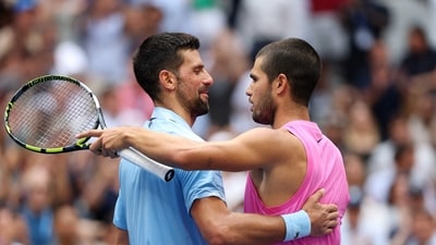 Carlos Alcaraz at the net after defeating Novak Djokovic. (Getty Images via AFP) Carlos Alcaraz at the net after defeating Novak Djokovic. (Getty Images via AFP)