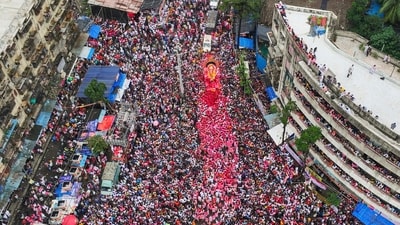 People take part in a Ganesh visarjan procession in Mumbai. (PTI/ Representational Image) People take part in a Ganesh visarjan procession in Mumbai. (PTI/ Representational Image)