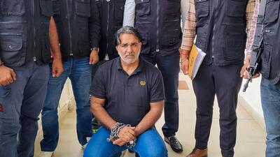 Mainpal with the STF team after being deported from Cambodia. (Parveen Kumar/HT Photo) Mainpal with the STF team after being deported from Cambodia. (Parveen Kumar/HT Photo)
