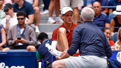 Jannik Sinner receives medical attention earlier in the US Open. (AFP) Jannik Sinner receives medical attention earlier in the US Open. (AFP)