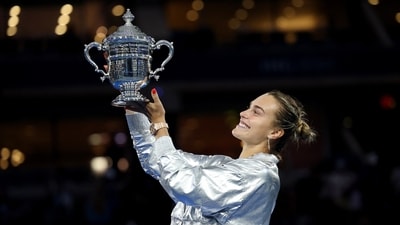 Aryna Sabalenka celebrates with the US Open trophy. (REUTERS)