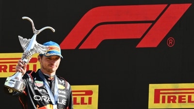 Red Bull Racing's Dutch driver Max Verstappen celebrates his victory on the podium after winning the Italian Formula One Grand Prix at the Autodromo Nazionale Monza circuit, in Monza, northern Italy, on September 7, 2025. (Photo by Philippe Lopez / AFP) (AFP) Red Bull Racing's Dutch driver Max Verstappen celebrates his victory on the podium after winning the Italian Formula One Grand Prix at the Autodromo Nazionale Monza circuit, in Monza, northern Italy, on September 7, 2025. (Photo by Philippe Lopez / AFP) (AFP)