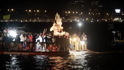 This year, an electrically-operated raft was used to immerse the idol, as opposed to mechanised rafts used earlier. (HT Photo)
