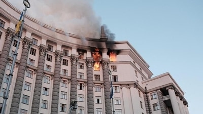 Firefighters work at the site of a headquarters building of the Ukrainian government damaged during Russian drone and missile strikes. (via REUTERS)