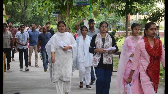 Candidates coming out of a centre after appearing in UPSSSC PET 2025 in Lucknow on September 7. (HT photo)