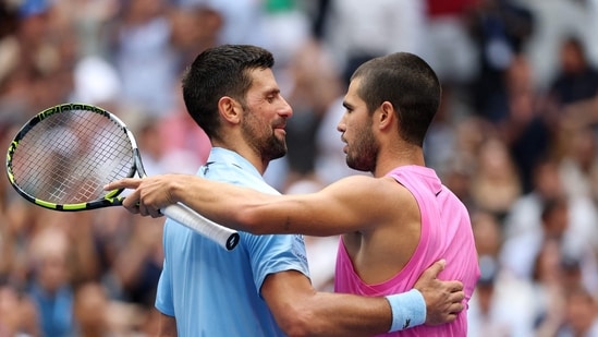 Carlos Alcaraz at the net after defeating Novak Djokovic. (Getty Images via AFP)