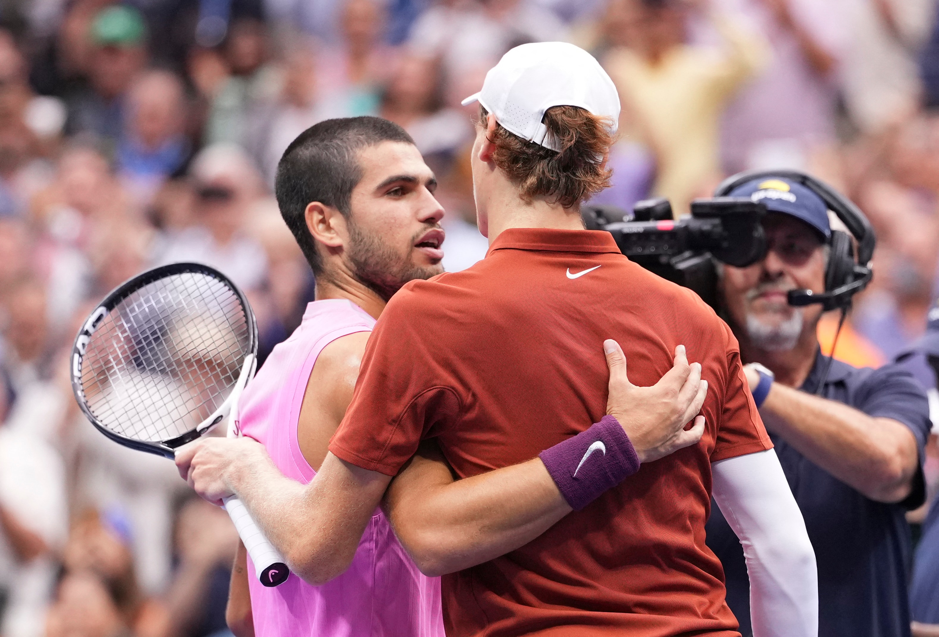 Sep 7, 2025; Flushing, NY, USA;  Carlos Alcaraz (ESP) hugs Jannik Sinner (ITA) after the final of mens singles at Billie Jean King National Tennis Center. Mandatory Credit: Robert Deutsch-Imagn Images (IMAGN IMAGES via Reuters Connect)