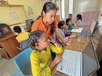 Children from slum areas attending a computer class being organised by an NGO in Ludhiana. (Gurpreet Singh/HT)