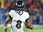 Baltimore Ravens quarterback Lamar Jackson runs with the ball against the Buffalo Bills.
