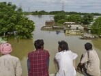 People stare at a flooded area following incessant rainfall in Jalandhar, Punjab. (PTI) People stare at a flooded area following incessant rainfall in Jalandhar, Punjab. (PTI)