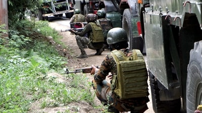 Indian Army soldiers stand guard at the encounter site where a jawan was killed in a gunfight with terrorists in Kulgam on Saturday. (ANI photo) Indian Army soldiers stand guard at the encounter site where a jawan was killed in a gunfight with terrorists in Kulgam on Saturday. (ANI photo)