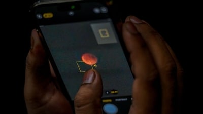 The “Blood Moon” total lunar eclipse on Sunday brought together millions of astronomy enthusiasts and professionals in India and various parts of the world. An enthusiast in UP's Noida trying to capture the celestial phenomenon on their phone. (Sunil Ghosh / Hindustan Times) The “Blood Moon” total lunar eclipse on Sunday brought together millions of astronomy enthusiasts and professionals in India and various parts of the world. An enthusiast in UP's Noida trying to capture the celestial phenomenon on their phone. (Sunil Ghosh / Hindustan Times)