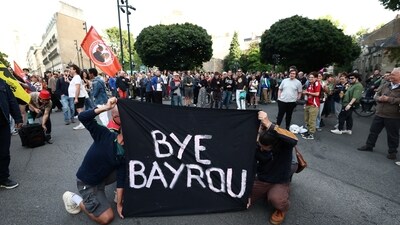 Protesters hold a banner which reads "Bye Bayrou" as they gather for a "Bayrou’s farewell party" protest in front of the city hall in Nantes, ON, September 8, 2025. (Reuters)