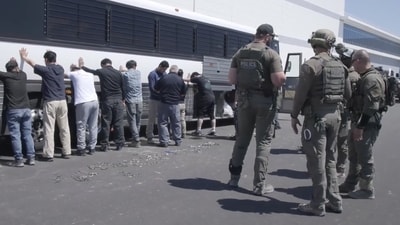 This image from video provided by U.S. Immigration and Customs Enforcement via DVIDS shows manufacturing plant employees waiting to have their legs shackled at the Hyundai Motor Group’s electric vehicle plant, Thursday, Sept. 4, 2025, in Ellabell, Ga. (Corey Bullard/U.S. Immigration and Customs Enforcement via AP) (AP) This image from video provided by U.S. Immigration and Customs Enforcement via DVIDS shows manufacturing plant employees waiting to have their legs shackled at the Hyundai Motor Group’s electric vehicle plant, Thursday, Sept. 4, 2025, in Ellabell, Ga. (Corey Bullard/U.S. Immigration and Customs Enforcement via AP) (AP)