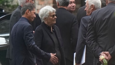 Rossana Armani, center, departs San Martino church following the funeral of her brother, designer Giorgio Armani. (AP Photo/Luca Bruno) (AP)