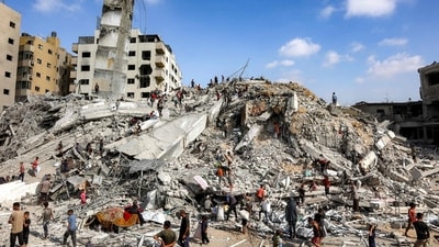 People search for salvage at the mound of rubble at the site of the collapsed Sussi Tower, which was destroyed earlier by Israeli bombardment, in Gaza City on September 6 (AFP) People search for salvage at the mound of rubble at the site of the collapsed Sussi Tower, which was destroyed earlier by Israeli bombardment, in Gaza City on September 6 (AFP)