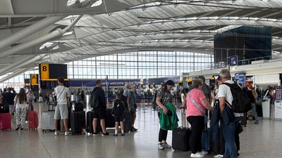 Passengers stand inside T5 at Heathrow airport after an air traffic control (ATC) fault caused major disruption on Wednesday, July 30, 2025. (AP) Passengers stand inside T5 at Heathrow airport after an air traffic control (ATC) fault caused major disruption on Wednesday, July 30, 2025. (AP)