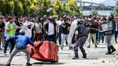 Demonstrators wield stones and sticks as they clash with riot police personnel during the protest against the blocking of at least 26 social media platforms not registered under the government's new rules. (AFP) Demonstrators wield stones and sticks as they clash with riot police personnel during the protest against the blocking of at least 26 social media platforms not registered under the government's new rules. (AFP)