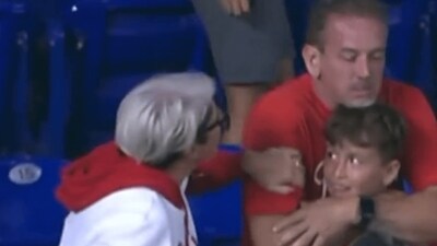 The video showed the woman, dubbed Phillies Karen, walk up to the family, grab the father's arm and demand the home run ball back. (X/@IgniteTruth) The video showed the woman, dubbed Phillies Karen, walk up to the family, grab the father's arm and demand the home run ball back. (X/@IgniteTruth)