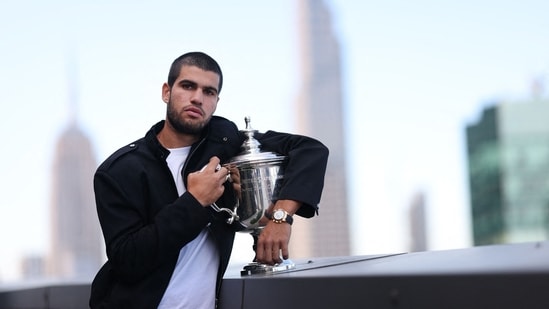 US Open 2025 Champion Carlos Alcaraz of Spain poses for a photo on the roof of the Lotte New York Palace Hotel with the Men's Singles trophy (Getty Images via AFP)