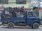 Policemen in riot gear patrol in a vehicle during curfew orders in Kathmandu, Nepal, Tuesday, Sept. 9, 2025. (AP Photo/Niranjan Shrestha)