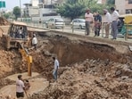 Deputy commissioner Komal Mittal inspecting the repair work on the damaged road and sewer pipeline near Phase 3B2 in Mohali on Monday. (HT Photo) Deputy commissioner Komal Mittal inspecting the repair work on the damaged road and sewer pipeline near Phase 3B2 in Mohali on Monday. (HT Photo)