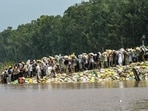 Villagers wade through floodwaters after a rise in the water level of the Ravi River following heavy monsoon rains in the Ghonewala village near Punjab's Amritsar on September 8, 2025. Villagers wade through floodwaters after a rise in the water level of the Ravi River following heavy monsoon rains in the Ghonewala village near Punjab's Amritsar on September 8, 2025.