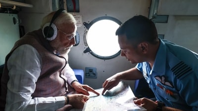 Prime Minister Narendra Modi conducts an aerial survey of flood and landslide-affected areas in Kangra on Tuesday. (Photo: PMO ) Prime Minister Narendra Modi conducts an aerial survey of flood and landslide-affected areas in Kangra on Tuesday. (Photo: PMO )