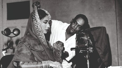 Damodar Kamat with Meena Kumari on the sets of Pakeezah. Damodar Kamat with Meena Kumari on the sets of Pakeezah.