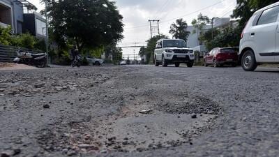 In Kaushambi, residents said that the upper layer of the roads has eroded during the monsoon. “We have potholes every 20-25 metres. Driving has become difficult, and jerks cannot be avoided. (Sakib Ali/HT Photos)