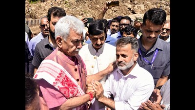 J&K LG Manoj Sinha during his visit at Thard village to review ongoing restoration works on NH-44, in Udhampur, on Tuesday. (ANI) J&K LG Manoj Sinha during his visit at Thard village to review ongoing restoration works on NH-44, in Udhampur, on Tuesday. (ANI)