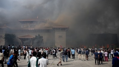 Smoke rises from the Parliament complex following fire set up during a protest against Monday's killing of 19 people after anti-corruption protests. (Reuters)