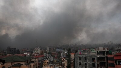 Smoke rises from the Nepal prime minister's office in Kathmandu after demonstrators set it on fire during a protest on Tuesday (REUTERS)
