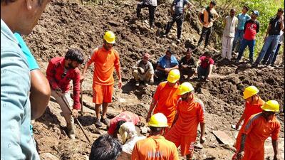 National Disaster Response Force members carrying out rescue work at the landslide-hit Sharmani village in Nirmand sub division of Kullu district on Tuesday. (Aqil Khan/HT) National Disaster Response Force members carrying out rescue work at the landslide-hit Sharmani village in Nirmand sub division of Kullu district on Tuesday. (Aqil Khan/HT)