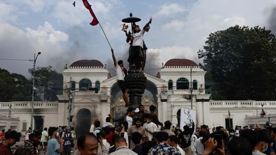 Demonstrators celebrate after successfully storming the Singha Durbar office complex, that houses the Prime Minister's office and other ministries, during a protest on Tuesday. (REUTERS) Demonstrators celebrate after successfully storming the Singha Durbar office complex, that houses the Prime Minister's office and other ministries, during a protest on Tuesday. (REUTERS)