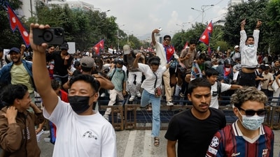 Students and youngsters raise hands and shout slogans as they gather in Kathmandu after protests in Nepal continue to erupt for the second day. (PTI) Students and youngsters raise hands and shout slogans as they gather in Kathmandu after protests in Nepal continue to erupt for the second day. (PTI)