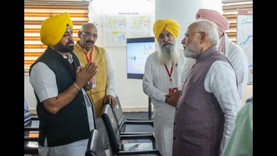 Prime Minister Narendra Modi interacting with Punjab cabinet ministers Gurmeet Singh Khudian and Hardeep Singh Mundian in Gurdaspur on Tuesday. (ANI) Prime Minister Narendra Modi interacting with Punjab cabinet ministers Gurmeet Singh Khudian and Hardeep Singh Mundian in Gurdaspur on Tuesday. (ANI)