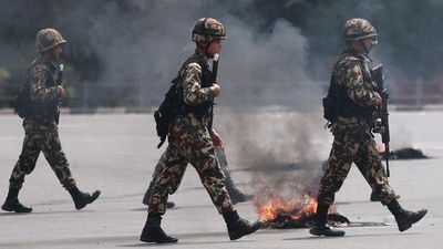 Soldiers of the Nepal Army walk with assault rifles during the second day of protests to condemn the police's deadly crackdown on demonstrators in Kathmandu. (Prabin Ranabhat/AFP) Soldiers of the Nepal Army walk with assault rifles during the second day of protests to condemn the police's deadly crackdown on demonstrators in Kathmandu. (Prabin Ranabhat/AFP)