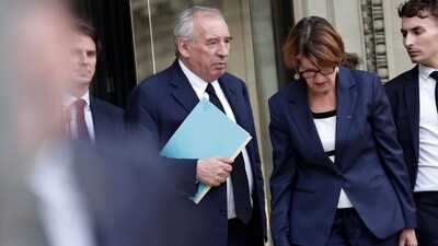France's Prime Minister Francois Bayrou leaves the National Assembly after the result of a confidence vote over the government's austerity budget, (AFP) France's Prime Minister Francois Bayrou leaves the National Assembly after the result of a confidence vote over the government's austerity budget, (AFP)