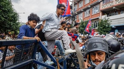 A student is seen crossing a barricade during protests in Nepal over social media ban and alleged corruption by the Nepal government. (PTI) A student is seen crossing a barricade during protests in Nepal over social media ban and alleged corruption by the Nepal government. (PTI)