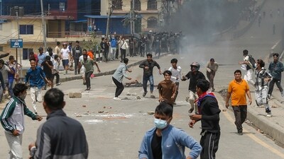 Kathmandu: Agitators flee after police personnel fired tear gas amid massive anti-government protests, in Kathmandu, Nepal, Tuesday, Sept. 9, 2025. Nepalese Prime Minister KP Sharma Oli resigned amid the protests. (PTI Photo/Abhishek Maharjan)(PTI09_09_2025_000411A) (PTI) Kathmandu: Agitators flee after police personnel fired tear gas amid massive anti-government protests, in Kathmandu, Nepal, Tuesday, Sept. 9, 2025. Nepalese Prime Minister KP Sharma Oli resigned amid the protests. (PTI Photo/Abhishek Maharjan)(PTI09_09_2025_000411A) (PTI)