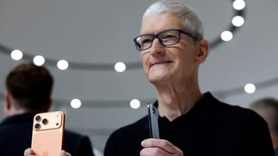 CUPERTINO: Apple CEO Tim Cook holds new iPhones during an Apple special event at Apple headquarters on September 09, 2025 in Cupertino, California. Apple unveiled a new generation of iPhones and updated Apple Watches and AirPods during a special event at Apple headquarters. (Getty Images via AFP) CUPERTINO: Apple CEO Tim Cook holds new iPhones during an Apple special event at Apple headquarters on September 09, 2025 in Cupertino, California. Apple unveiled a new generation of iPhones and updated Apple Watches and AirPods during a special event at Apple headquarters. (Getty Images via AFP)