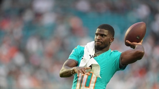 Miami Dolphins wide receiver Tyreek Hill (10) throws the football on the sidelines. (AP)