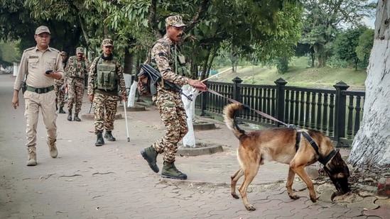 An Army personnel with a sniffer dog conducts a careful scan of the area at Imphal's Kangla Fort as part of heightened security measures on the eve of Prime Minister Narendra Modi's visit, (ANI)